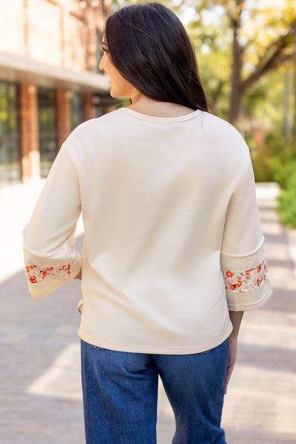 Flower Exposed Seam Wide Sleeve Top